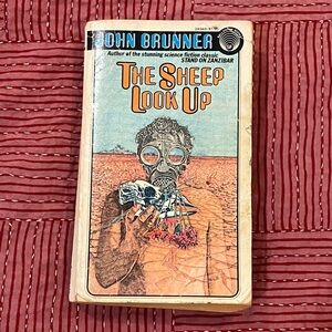 John Brunner's The Sheep Look Up softcover paperback Book - vintage 1976 edition